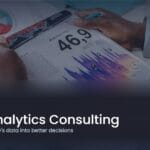 A professional reviewing reports and data charts on a desk, illustrating data analytics consulting