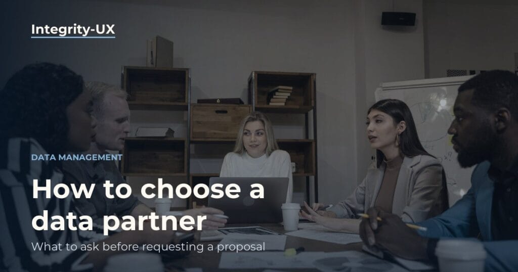 Work meeting around a table, with people talking and listening